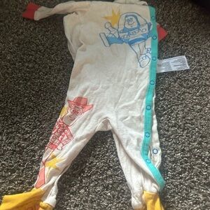 Disney Toy Story Kids Footie Pajama - Cream with Red, Blue, and Yellow Accents